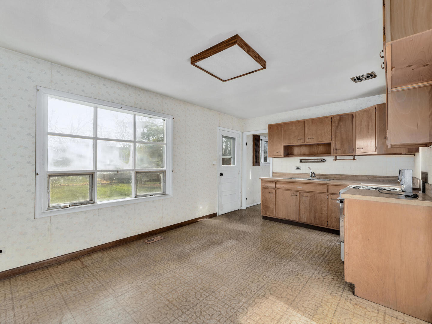 21W241 Coronet Road Lombard, IL 60148 - Photo 8 of 24 a kitchen with stainless steel appliances a refrigerator sink and cabinets