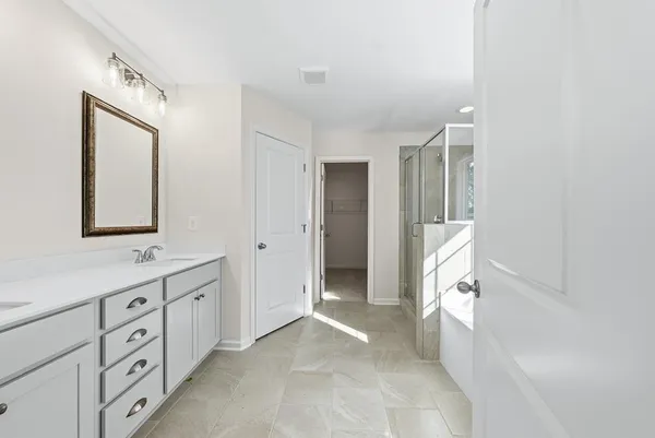 a view of bathroom with dual sinks