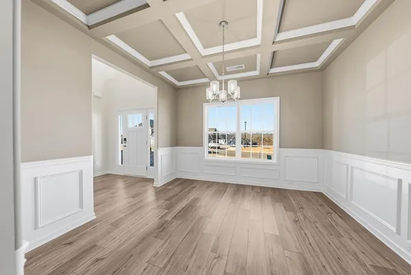 a view of a kitchen and wooden floor