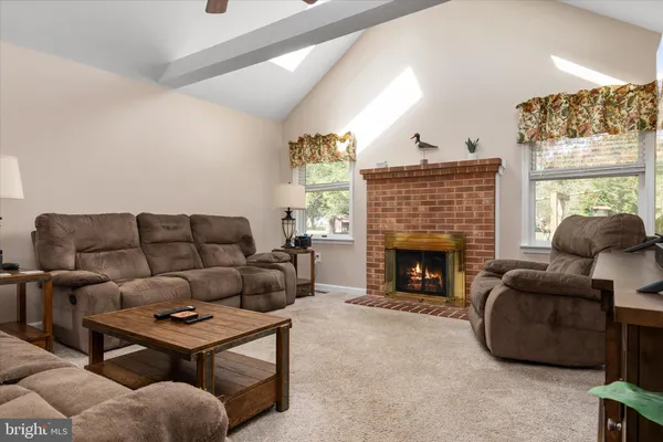 a outdoor dining space with furniture and window
