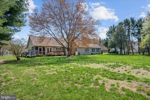 a bathroom with a double vanity sink toilet and a mirror