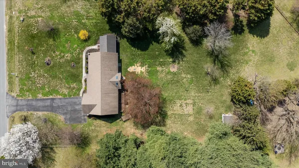 a bird view of water house with yard