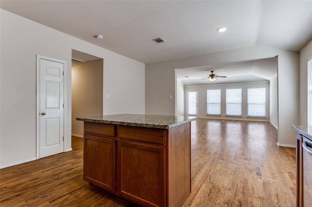9710 Revolution Way Frisco, TX 75033 - Photo 12 of 25 a view of a kitchen with a sink and wooden floor