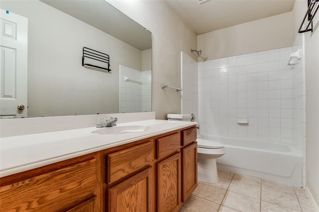9710 Revolution Way Frisco, TX 75033 - Photo 24 of 25 a bathroom with a sink a toilet and shower