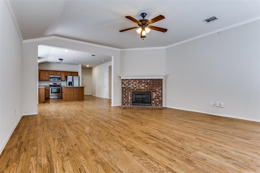 9710 Revolution Way Frisco, TX 75033 - Photo 3 of 25 a view of empty room with a fireplace
