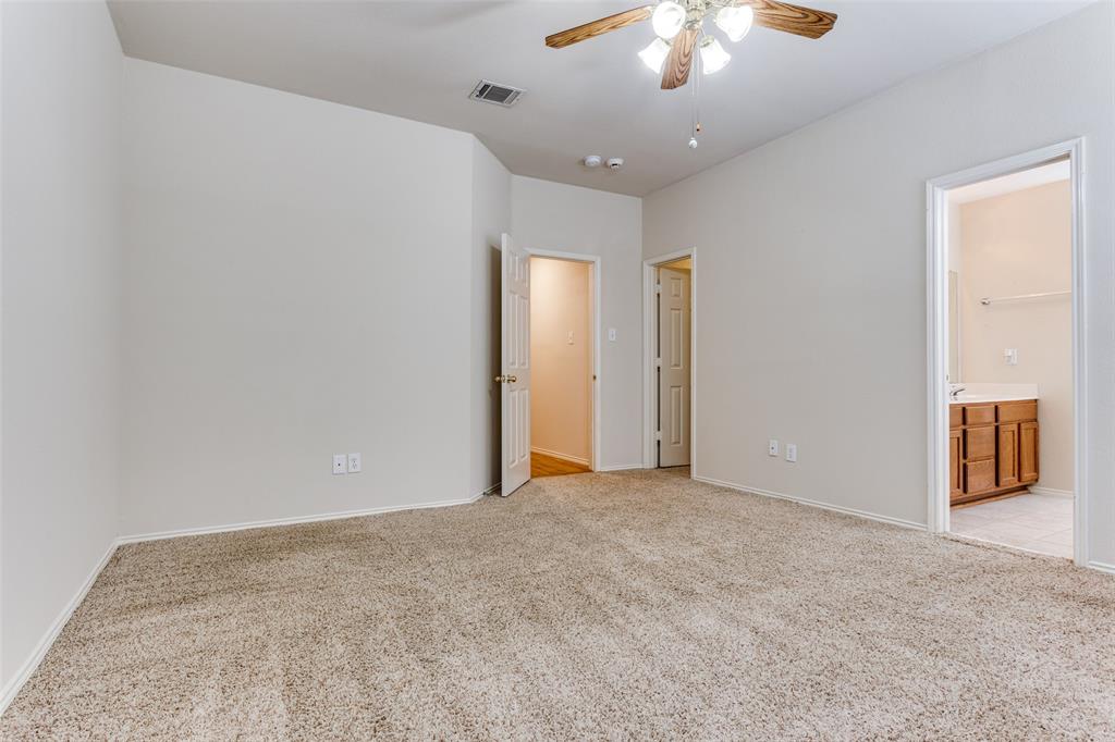 9710 Revolution Way Frisco, TX 75033 - Photo 4 of 25 a view of an empty room with a chandelier fan