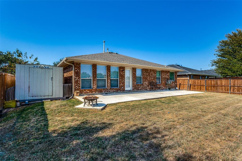 9710 Revolution Way Frisco, TX 75033 - Photo 6 of 25 a front view of a house with a yard