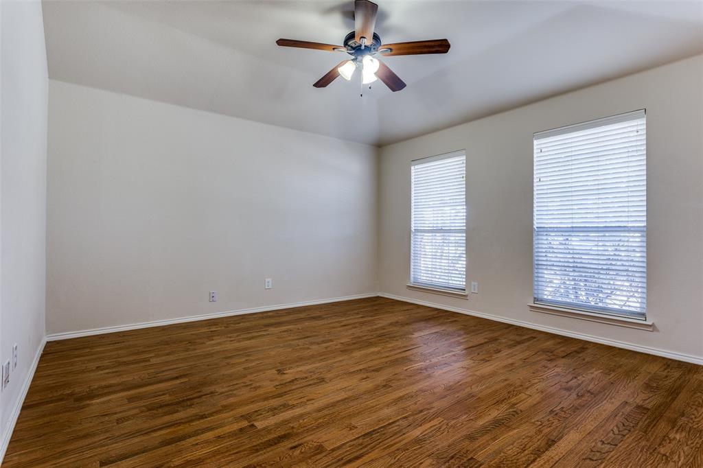 9710 Revolution Way Frisco, TX 75033 - Photo 8 of 25 a view of an empty room with window and a chandelier fan