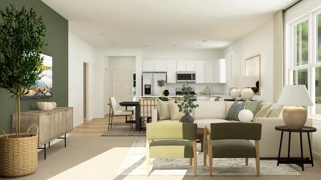 a living room with furniture and a potted plant