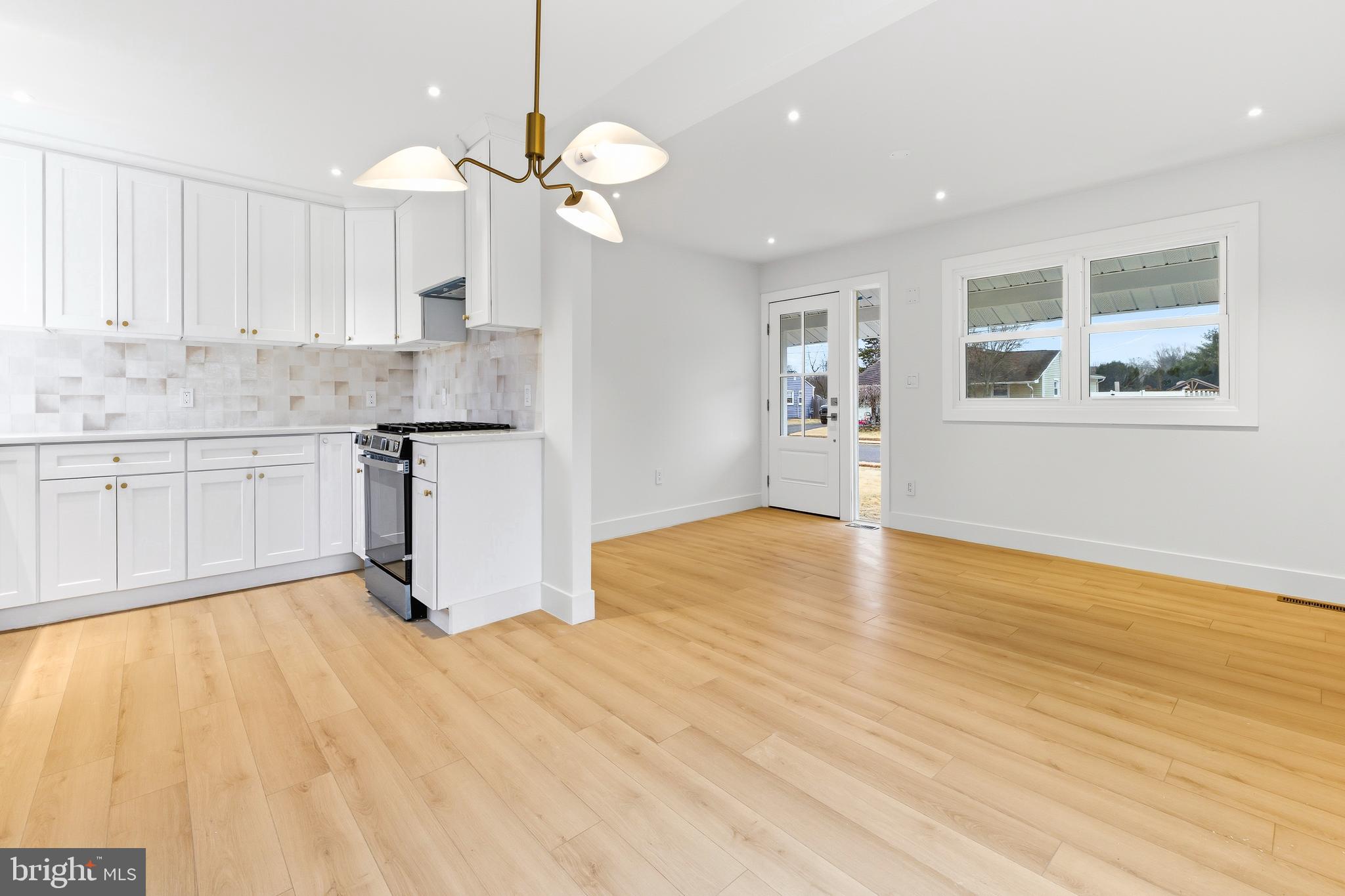 68 Craig Drive Deptford, NJ 08096 - Photo 6 of 20 a view of kitchen with granite countertop cabinets and wooden floor