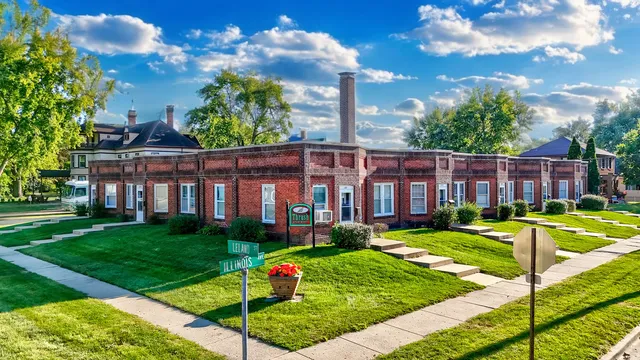a view of a house with a swimming pool and a yard