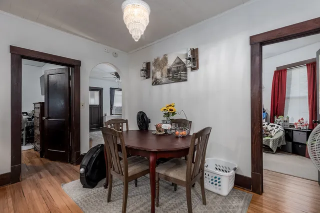a view of a dining room with furniture and wooden floor