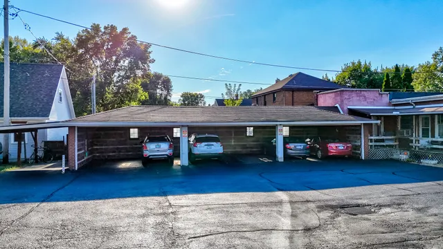 a view of a car park in front of house