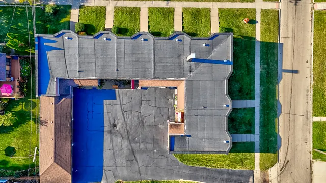 a aerial view of a house with a garden and plants