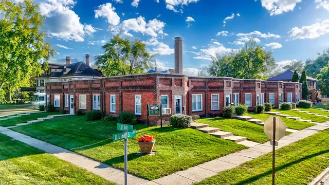 a view of a house with a swimming pool and a yard