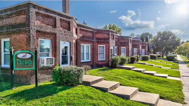 a view of a building with a yard