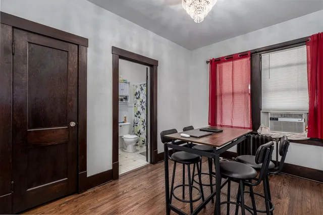 a view of a dining room with furniture and window
