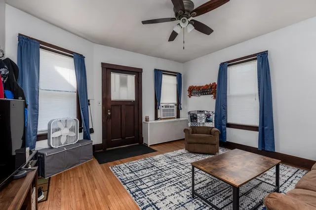 a living room with furniture and a rug
