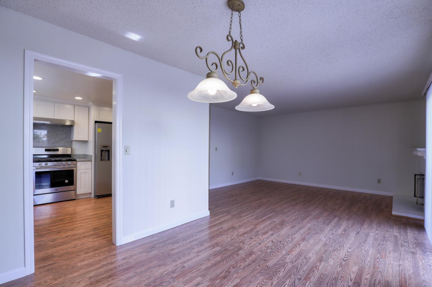 271 Michigan Road Milpitas, CA 95035 - Photo 14 of 34 a view of a kitchen with a sink wooden floor and a chandelier