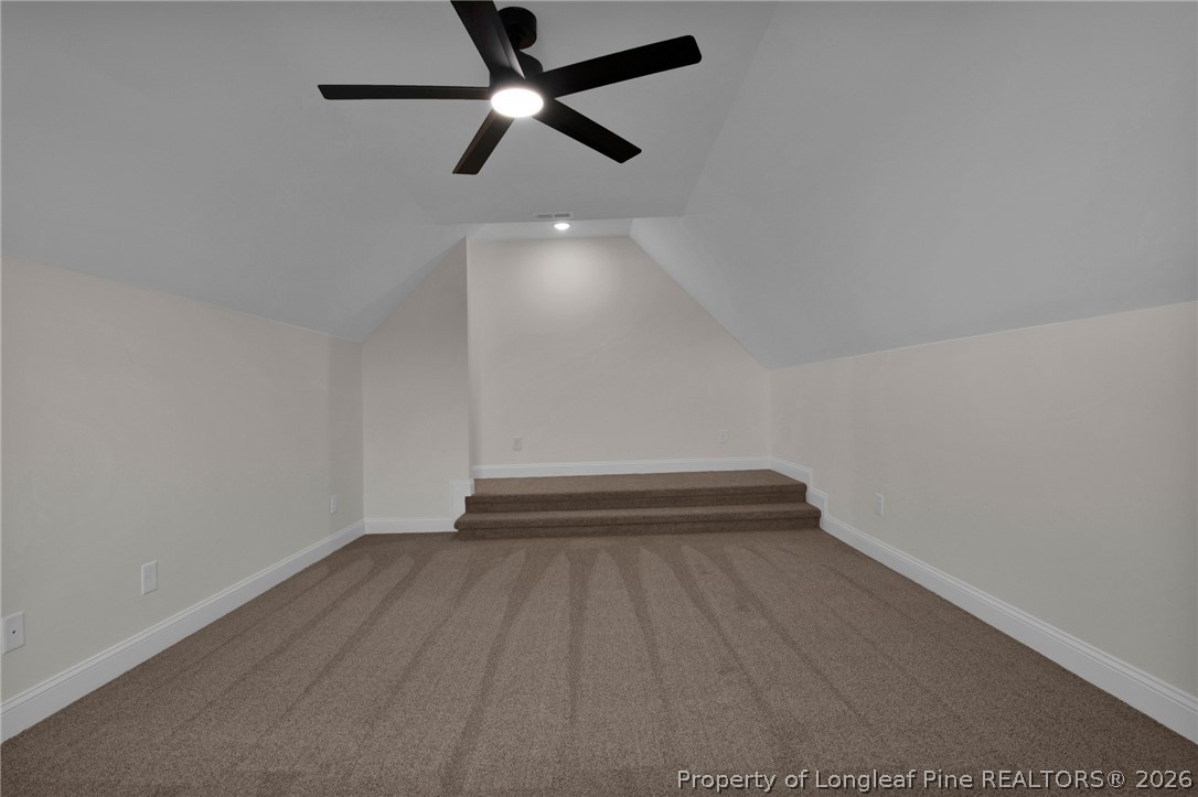 116 Surveyor Street Raeford, NC 28376 - Photo 28 of 45 an empty room with a ceiling fan and wooden floor
