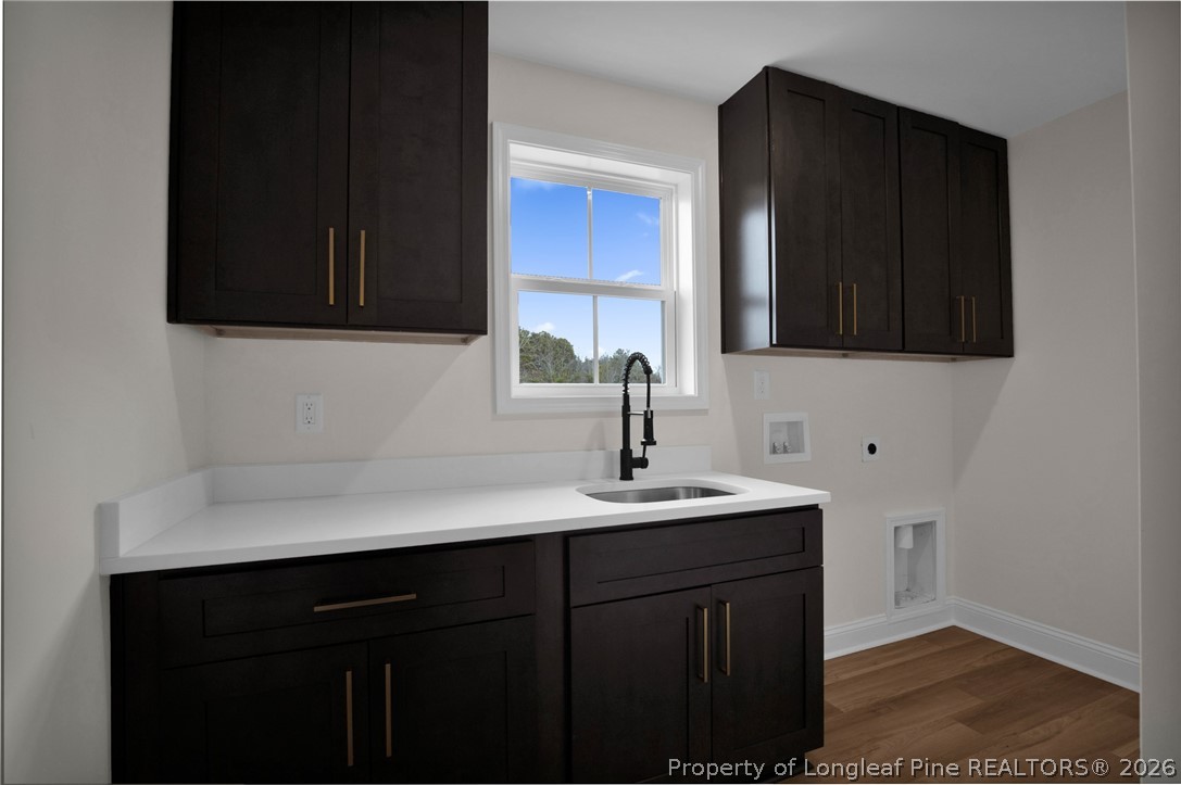 116 Surveyor Street Raeford, NC 28376 - Photo 29 of 45 a kitchen with a sink and cabinets