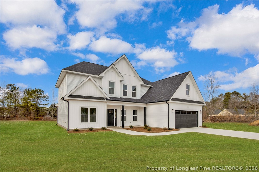 116 Surveyor Street Raeford, NC 28376 - Photo 3 of 45 a front view of a house with a yard