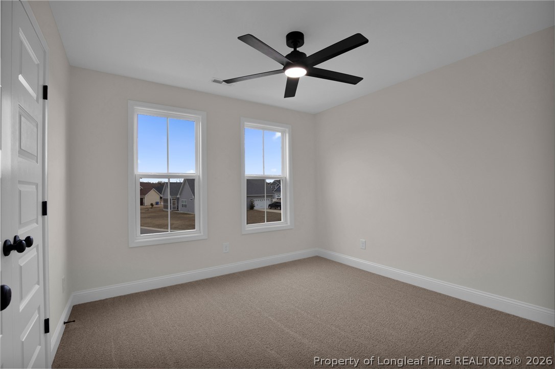 116 Surveyor Street Raeford, NC 28376 - Photo 33 of 45 an empty room with windows and fan