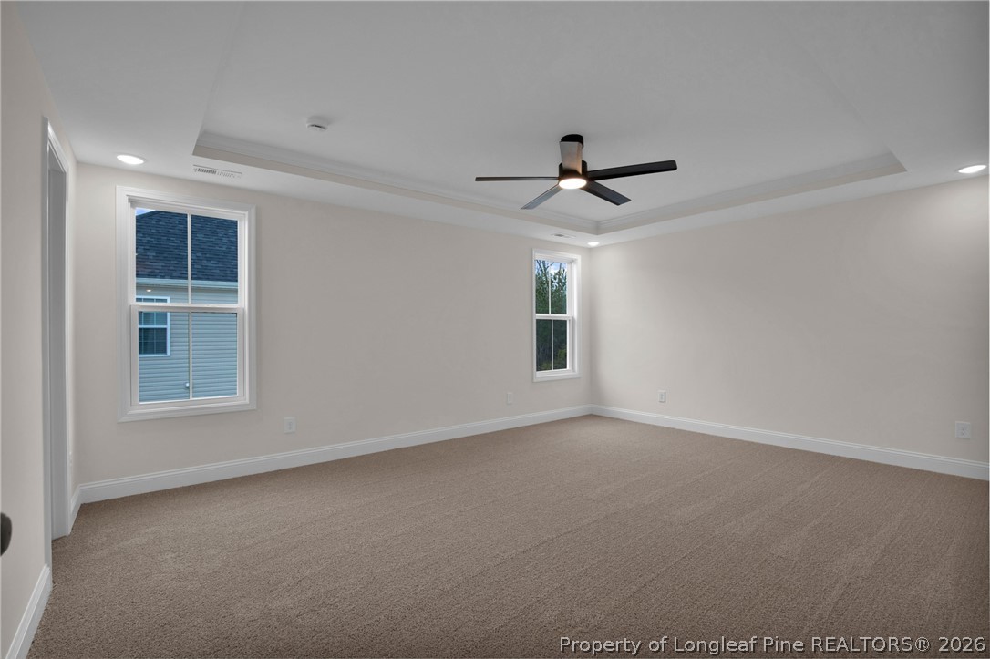 116 Surveyor Street Raeford, NC 28376 - Photo 36 of 45 an empty room with windows and ceiling fan