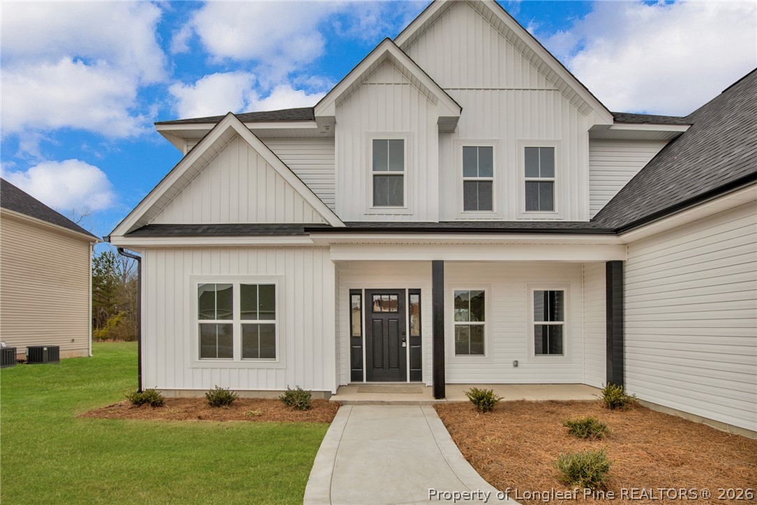 116 Surveyor Street Raeford, NC 28376 - Photo 4 of 45 a front view of a house with a yard