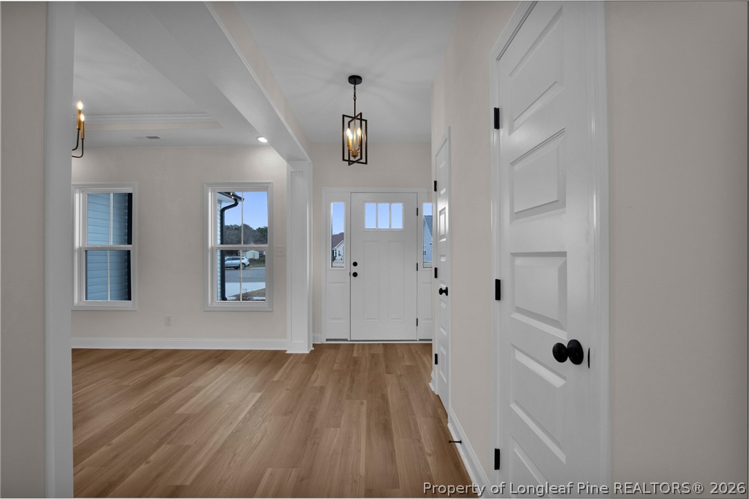 116 Surveyor Street Raeford, NC 28376 - Photo 5 of 45 wooden floor in an empty room with a window