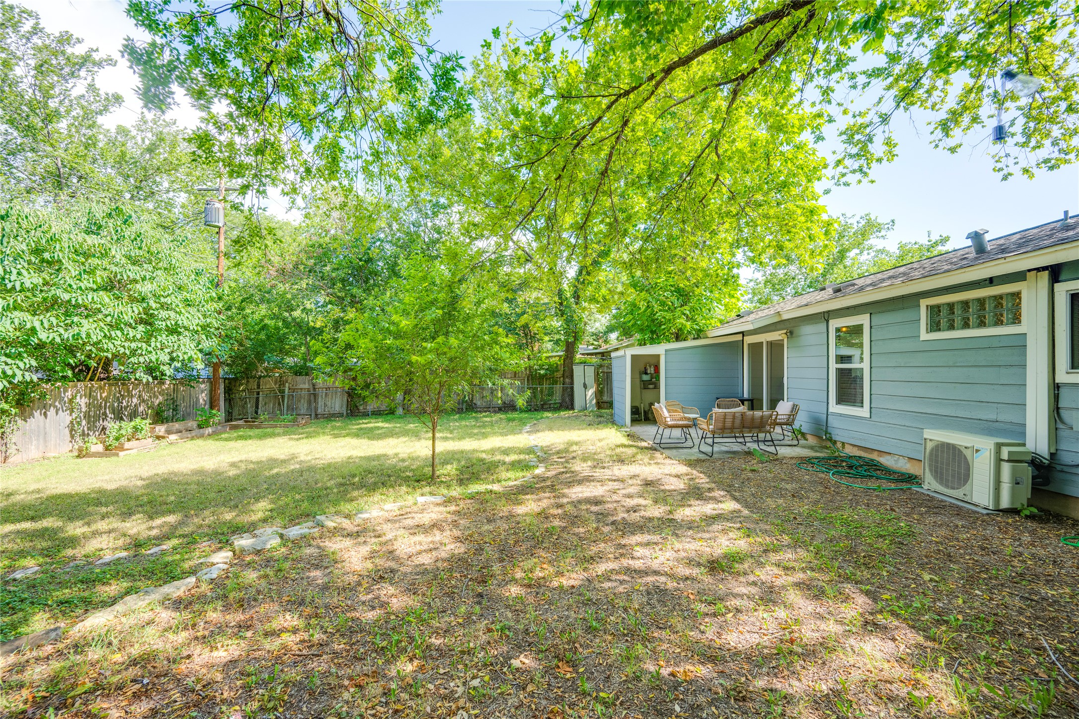 5300 Halmark Drive Austin, TX 78723 - Photo 26 of 40 A spacious yard with mature trees provides a natural, private setting.
