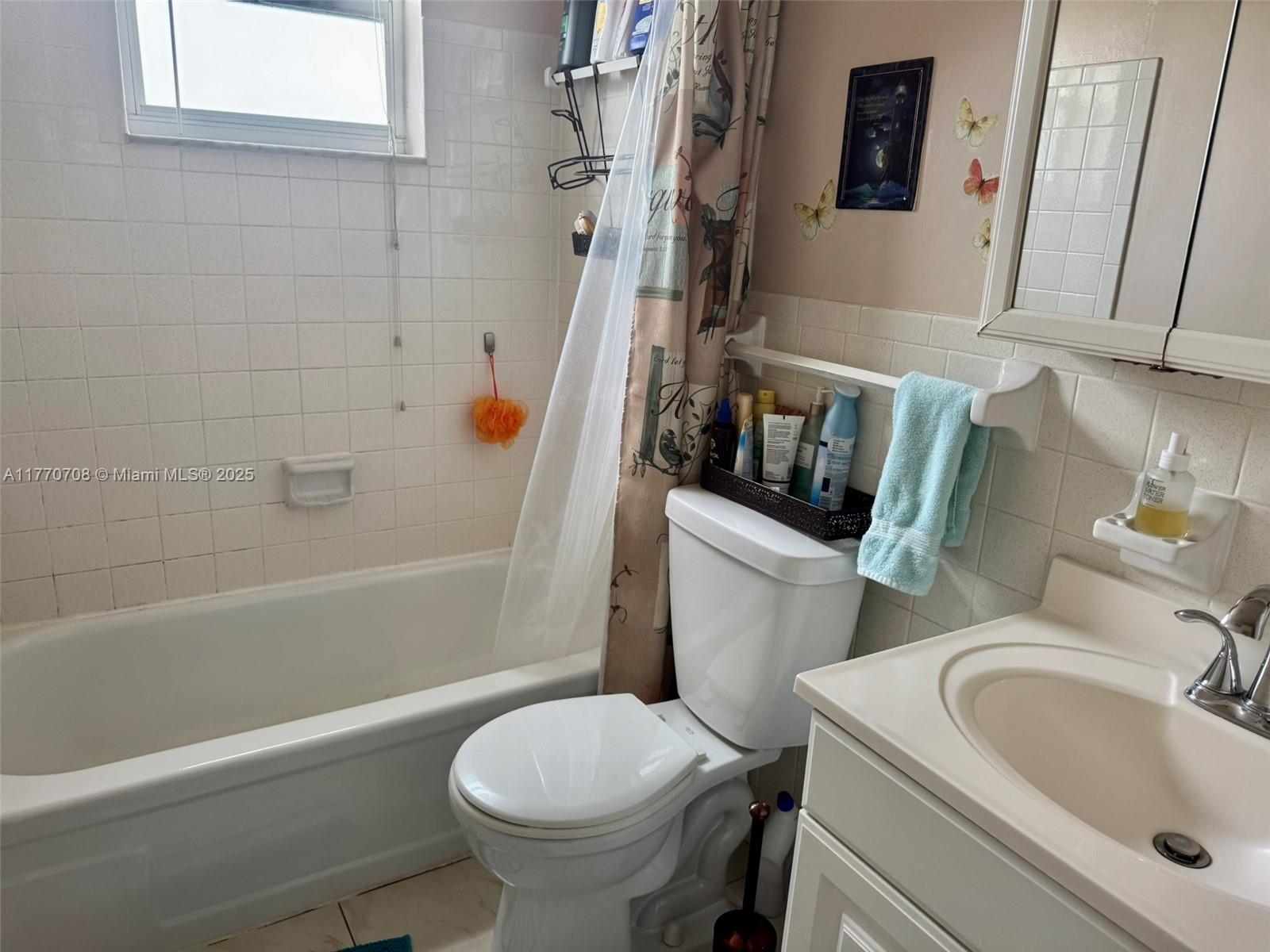 2145 Pierce Street, Unit 403 Hollywood, FL 33020 - Photo 8 of 10 a bathroom with a sink toilet and shower