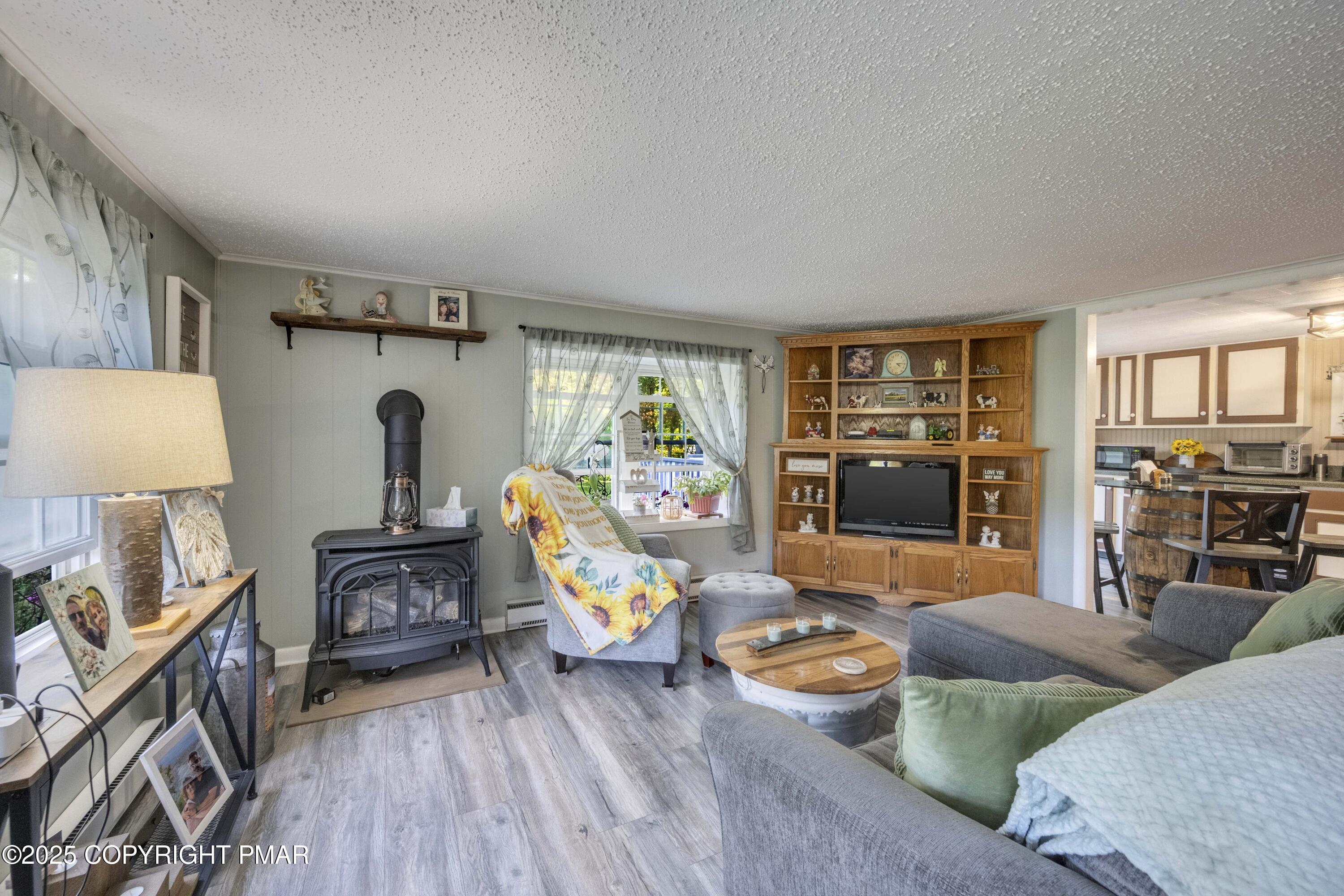 117 Streamside Street Kunkletown, PA 18058 - Photo 17 of 37 a living room with furniture and a wooden floor