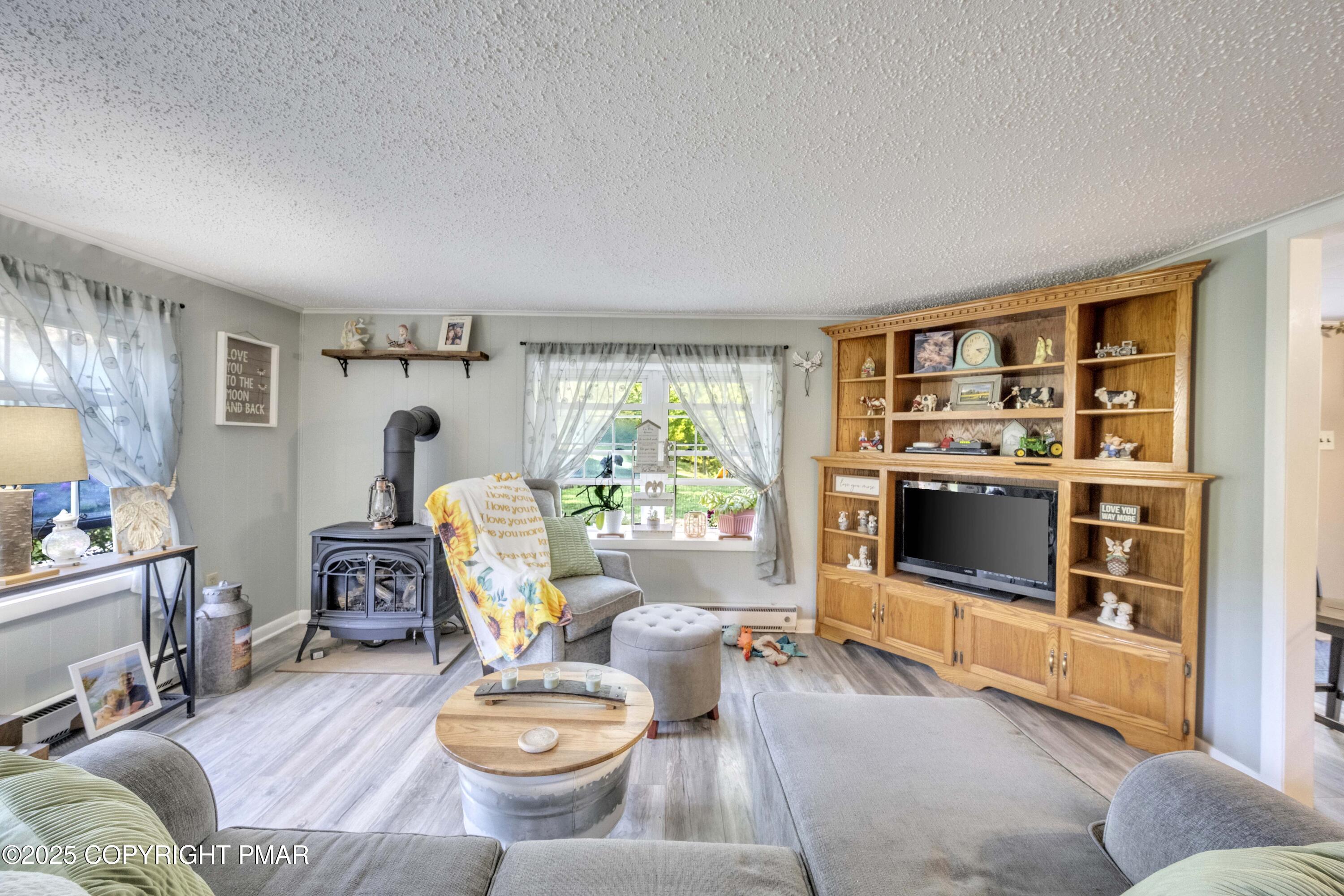 117 Streamside Street Kunkletown, PA 18058 - Photo 18 of 37 a living room with furniture and a wooden floor