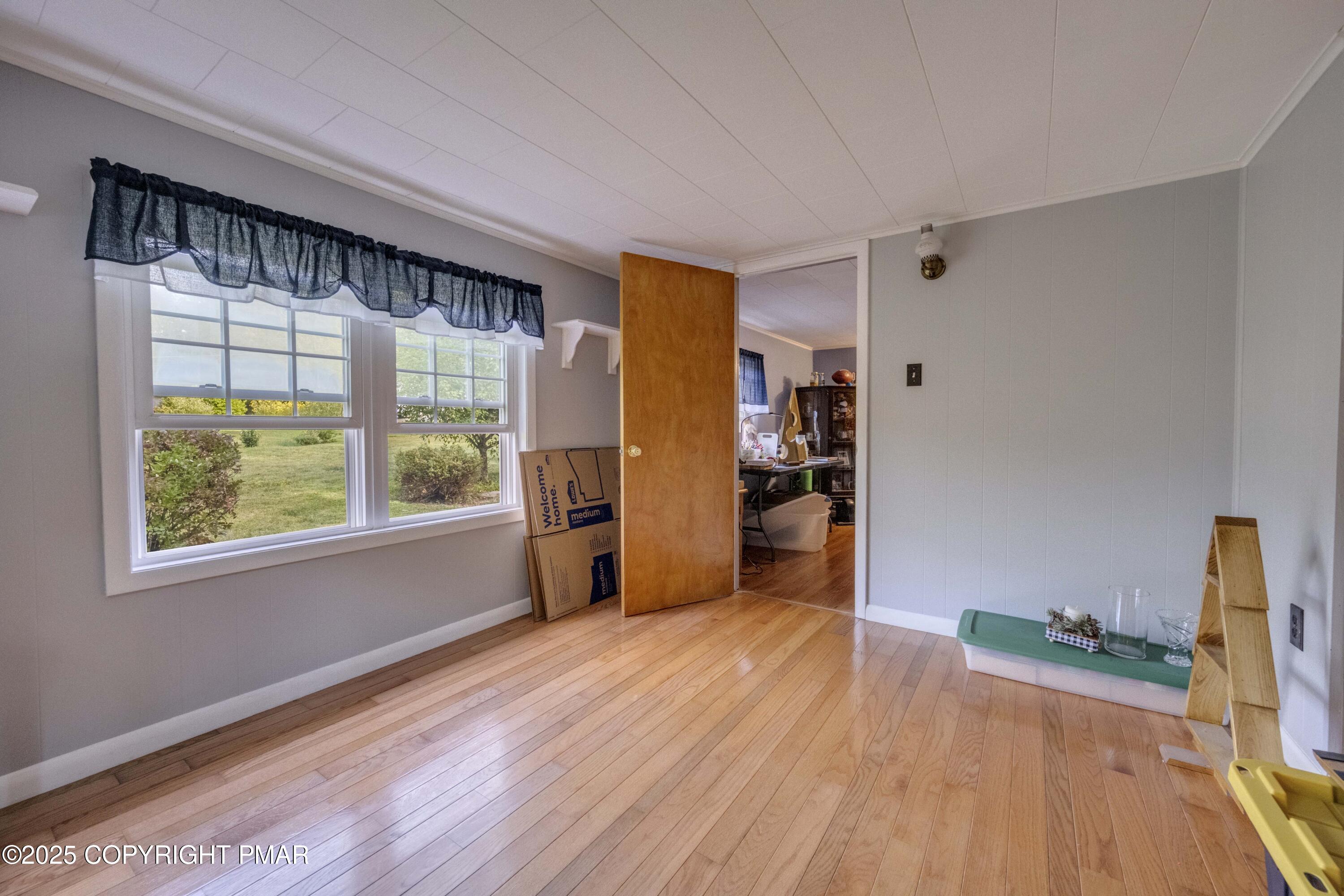 117 Streamside Street Kunkletown, PA 18058 - Photo 25 of 37 a view of empty room with wooden floor and fan