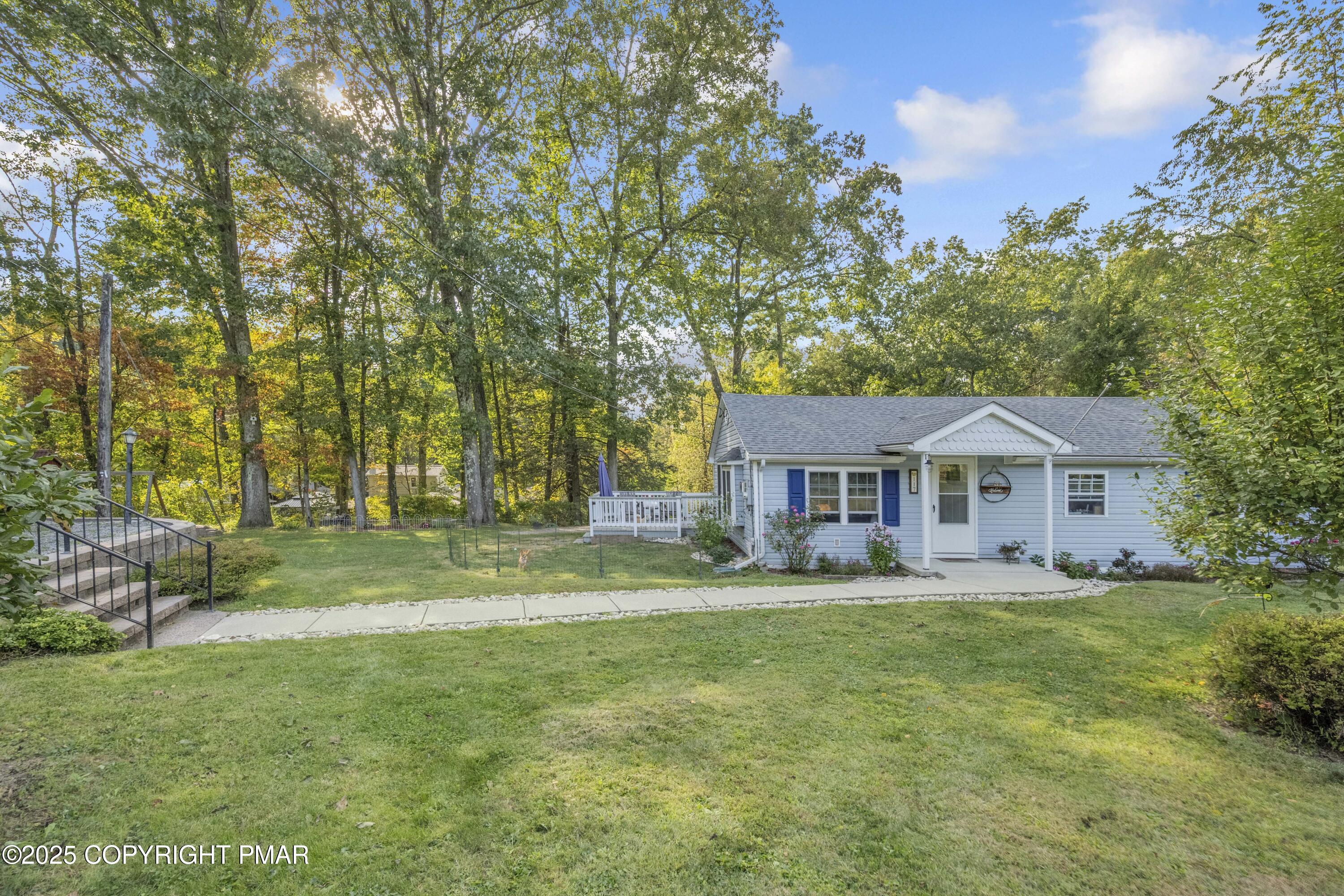 117 Streamside Street Kunkletown, PA 18058 - Photo 3 of 37 a view of a house with a big yard and large trees