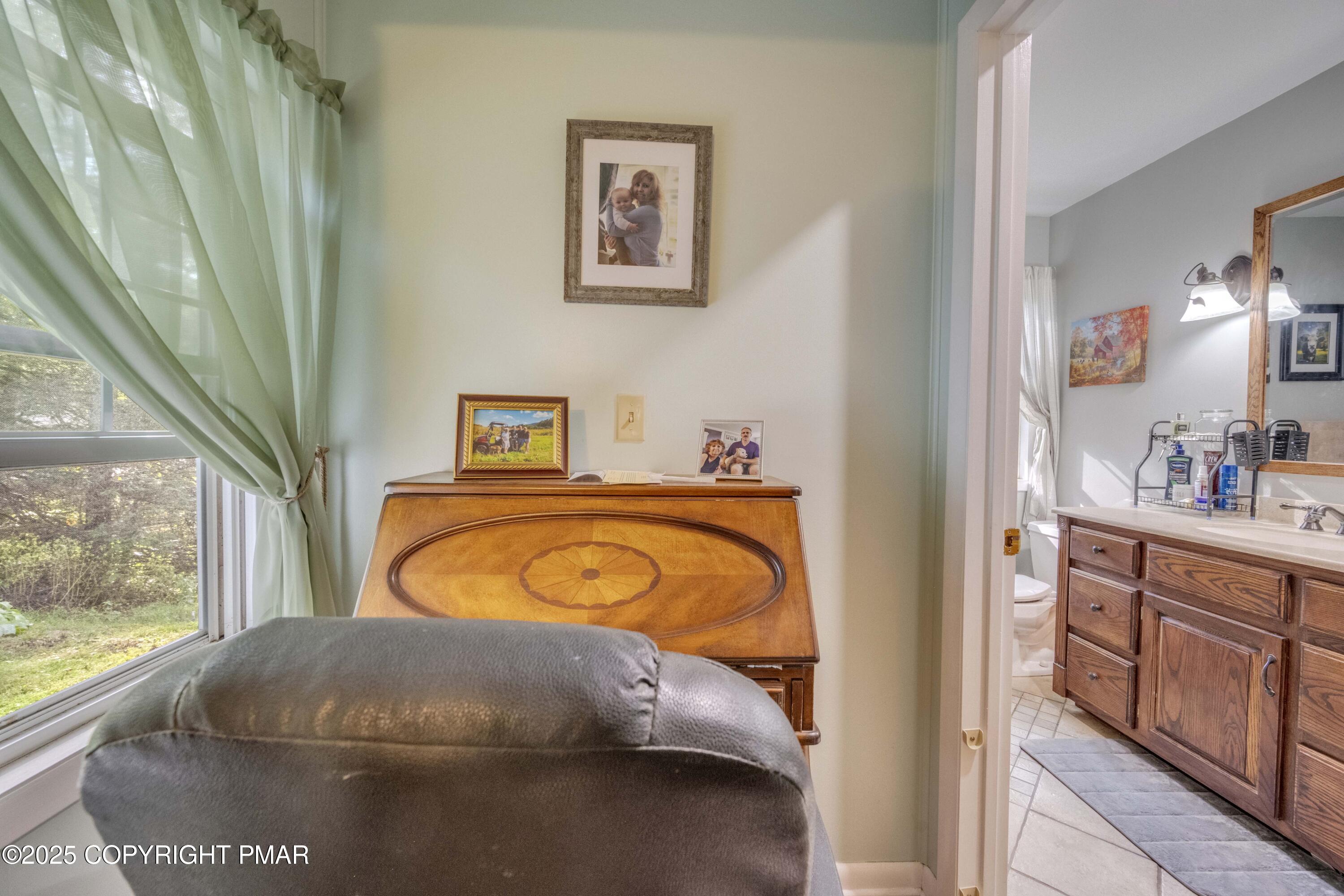 117 Streamside Street Kunkletown, PA 18058 - Photo 32 of 37 a bedroom with a bed and window