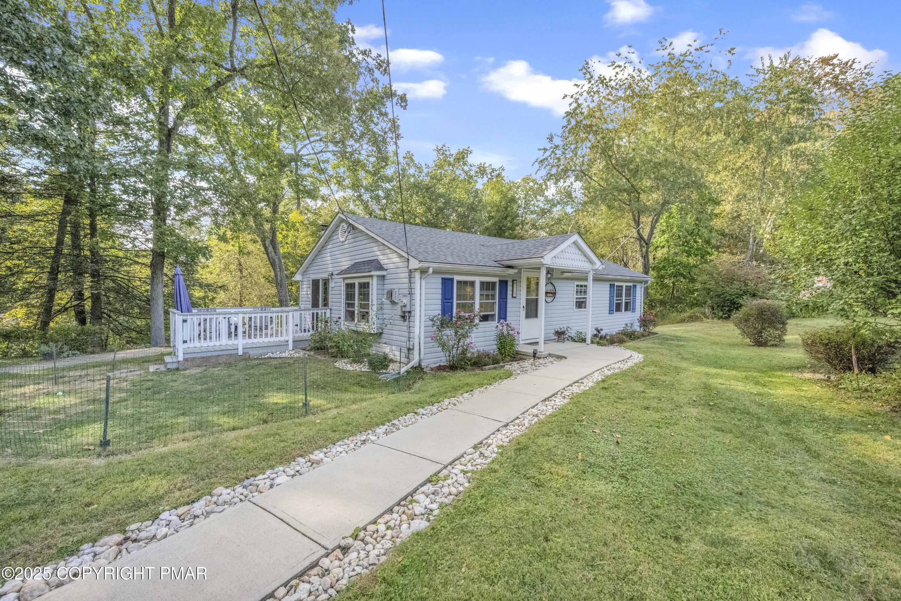 117 Streamside Street Kunkletown, PA 18058 - Photo 4 of 37 a front view of a house with a yard and garage