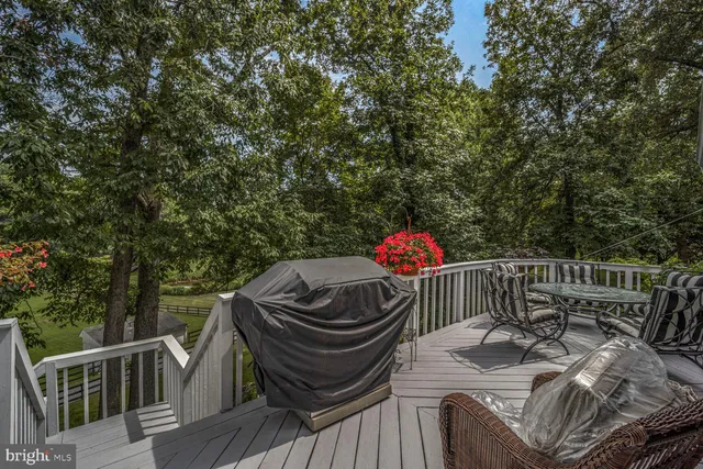 a bathroom with a sink vanity tub and a mirror