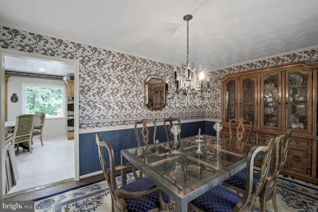 a bedroom with a bed couch and dresser