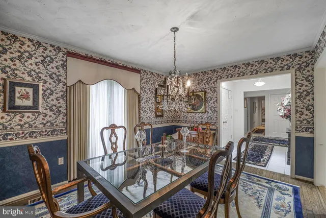 a bedroom with a bed dresser and a large mirror