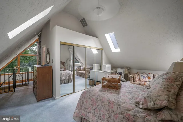 a front view of a house with plants