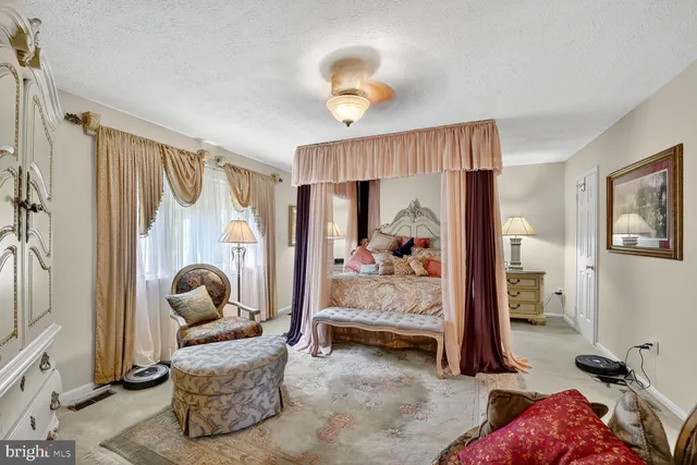 a bedroom with furniture and a window