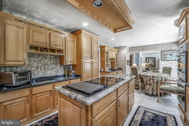 a spacious bathroom with a tub shower and toilet