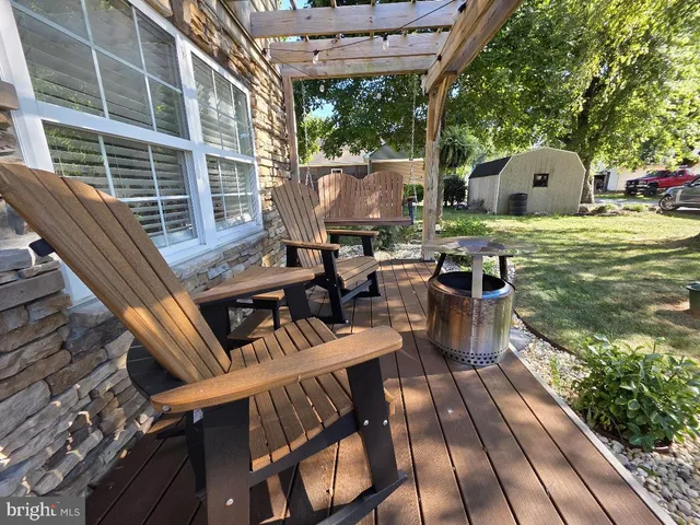 a view of balcony with chairs and wooden floor