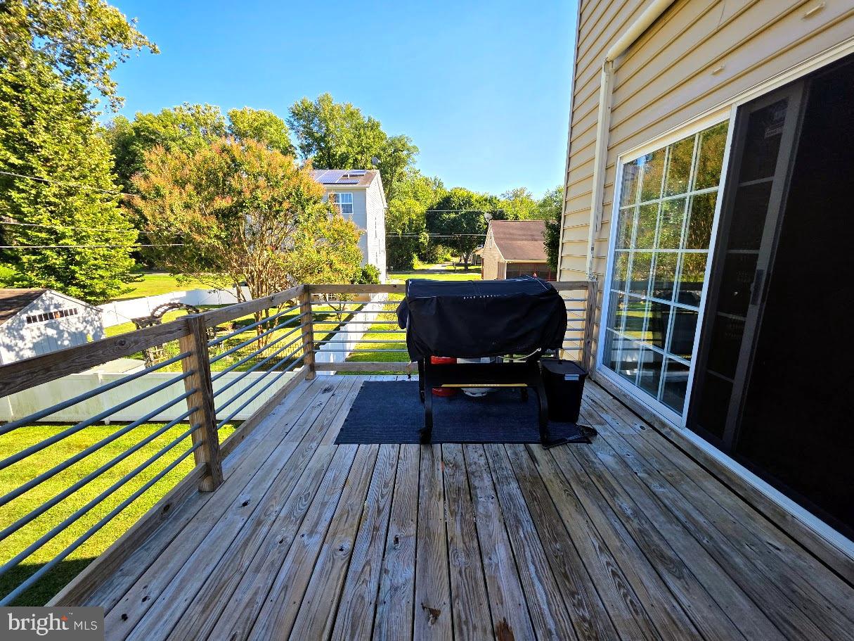8 Elk Lane Elkton, MD 21921 - Photo 14 of 19 a view of balcony with chairs and wooden floor
