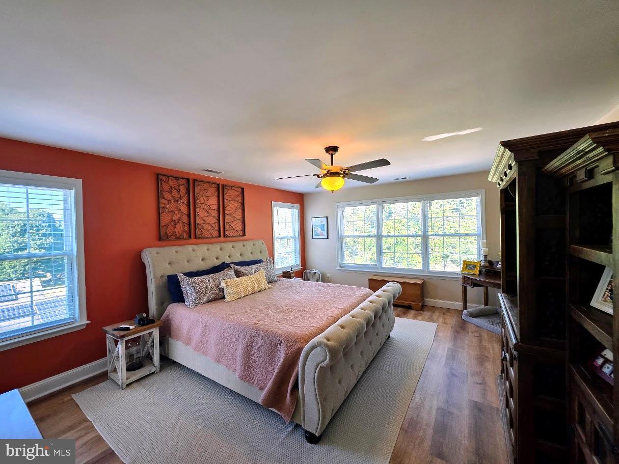 8 Elk Lane Elkton, MD 21921 - Photo 7 of 19 a bedroom with a bed and a large window