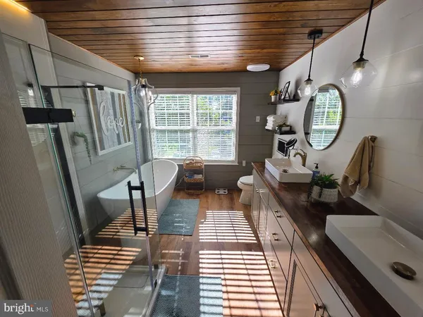 a living room with furniture a window and a table