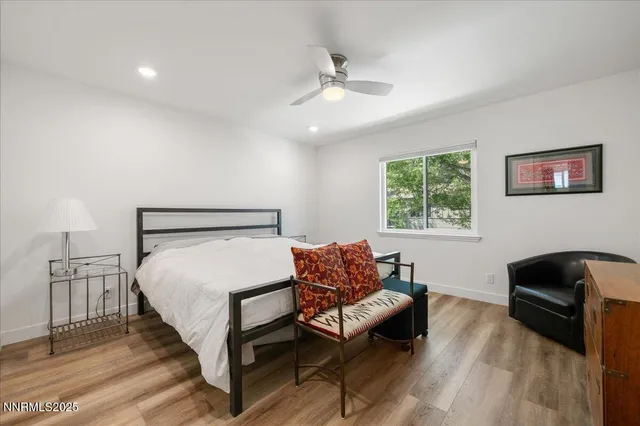 a bedroom with furniture and a window