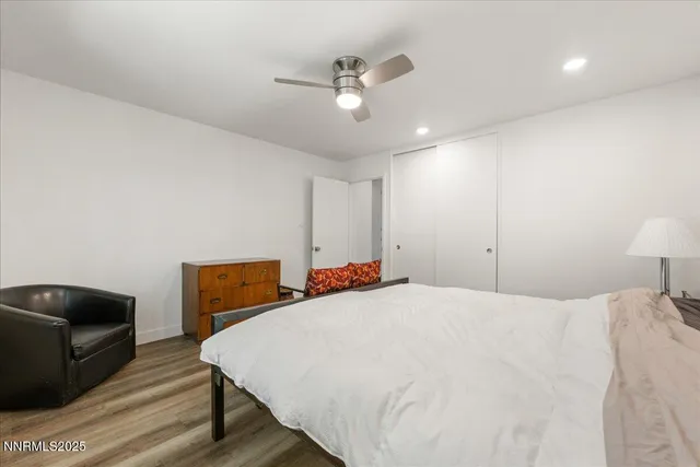 a bed room with a bed and a television